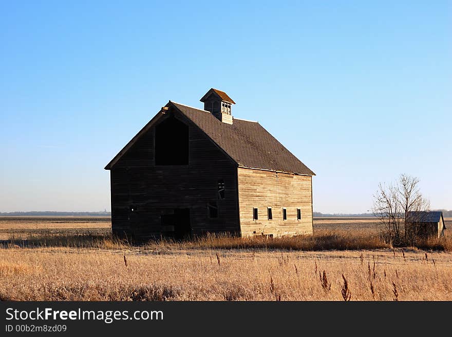 Rustic old barn isolated in the countryside.