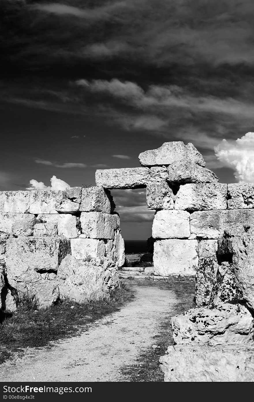 The ancient ruin of the Eurialo Greek Castle. Visible the door to soldiers room. The ancient ruin of the Eurialo Greek Castle. Visible the door to soldiers room