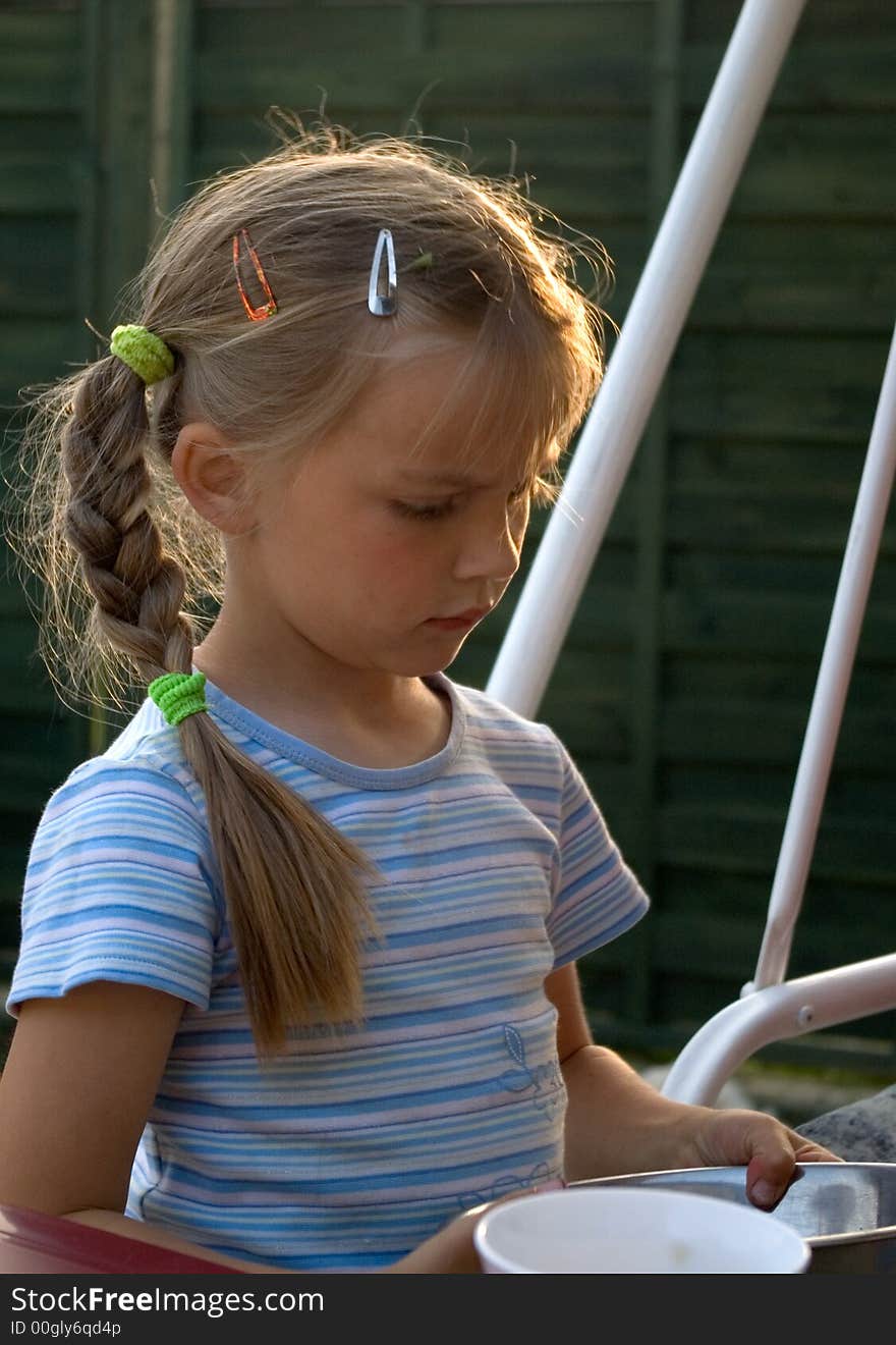 A cute blond hair girl in a garden, standing next to a table, holding some dishes.

<a href='http://www.dreamstime.com/kids-rcollection4583-resi208938' STYLE='font-size:13px; text-decoration: blink; color:#FF0000'><b>MY KIDS COLLECTION »</b></a>. A cute blond hair girl in a garden, standing next to a table, holding some dishes.

<a href='http://www.dreamstime.com/kids-rcollection4583-resi208938' STYLE='font-size:13px; text-decoration: blink; color:#FF0000'><b>MY KIDS COLLECTION »</b></a>