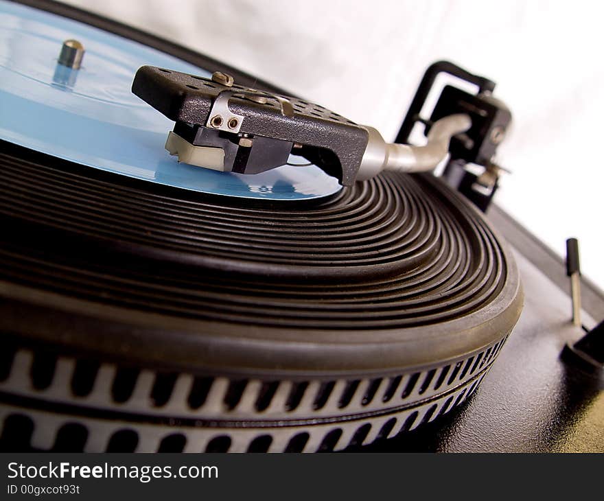 Gramophone with blue record on it.