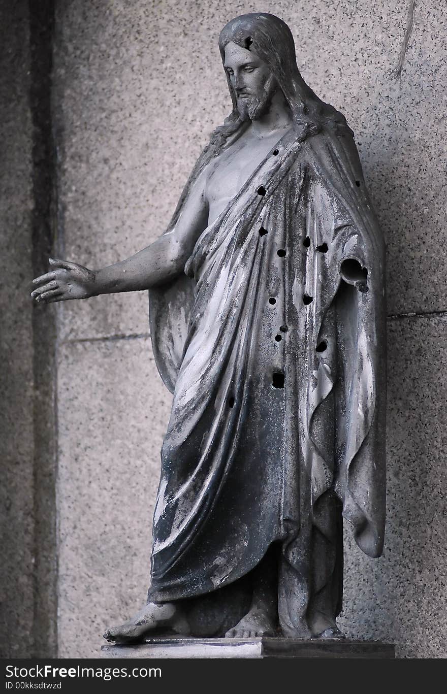 Statue of Jesus Christ with holes of gun          in The Second World War.