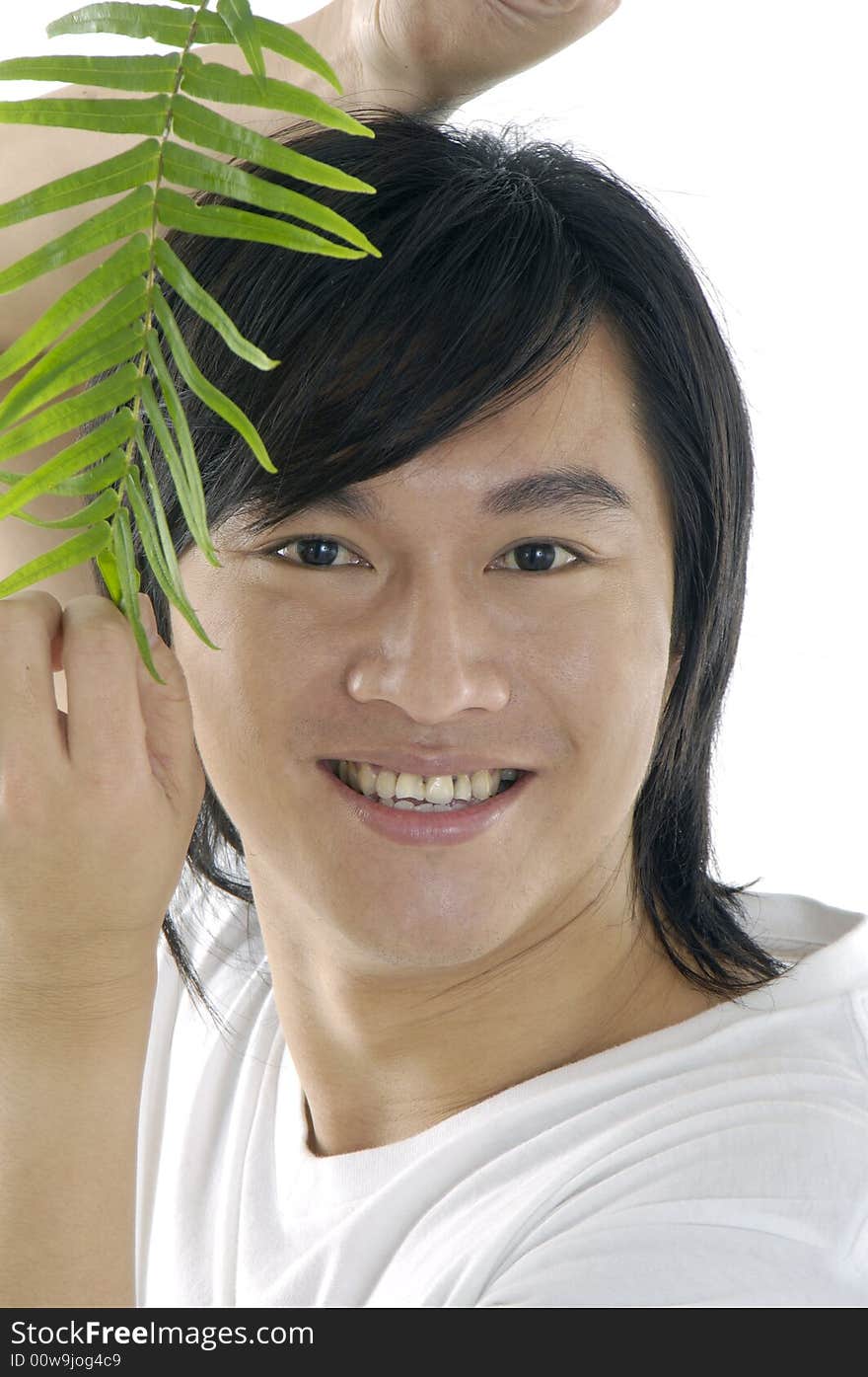 Young man on holding a small plant