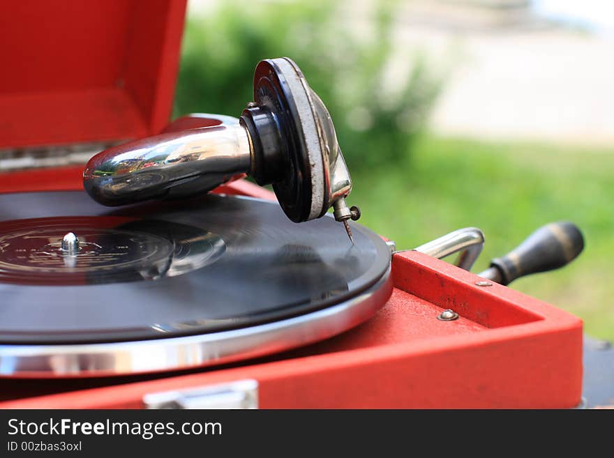 The antiquarian portable gramophone with disc, outdoor. The antiquarian portable gramophone with disc, outdoor