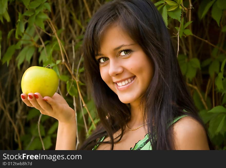 The brunette with an apple