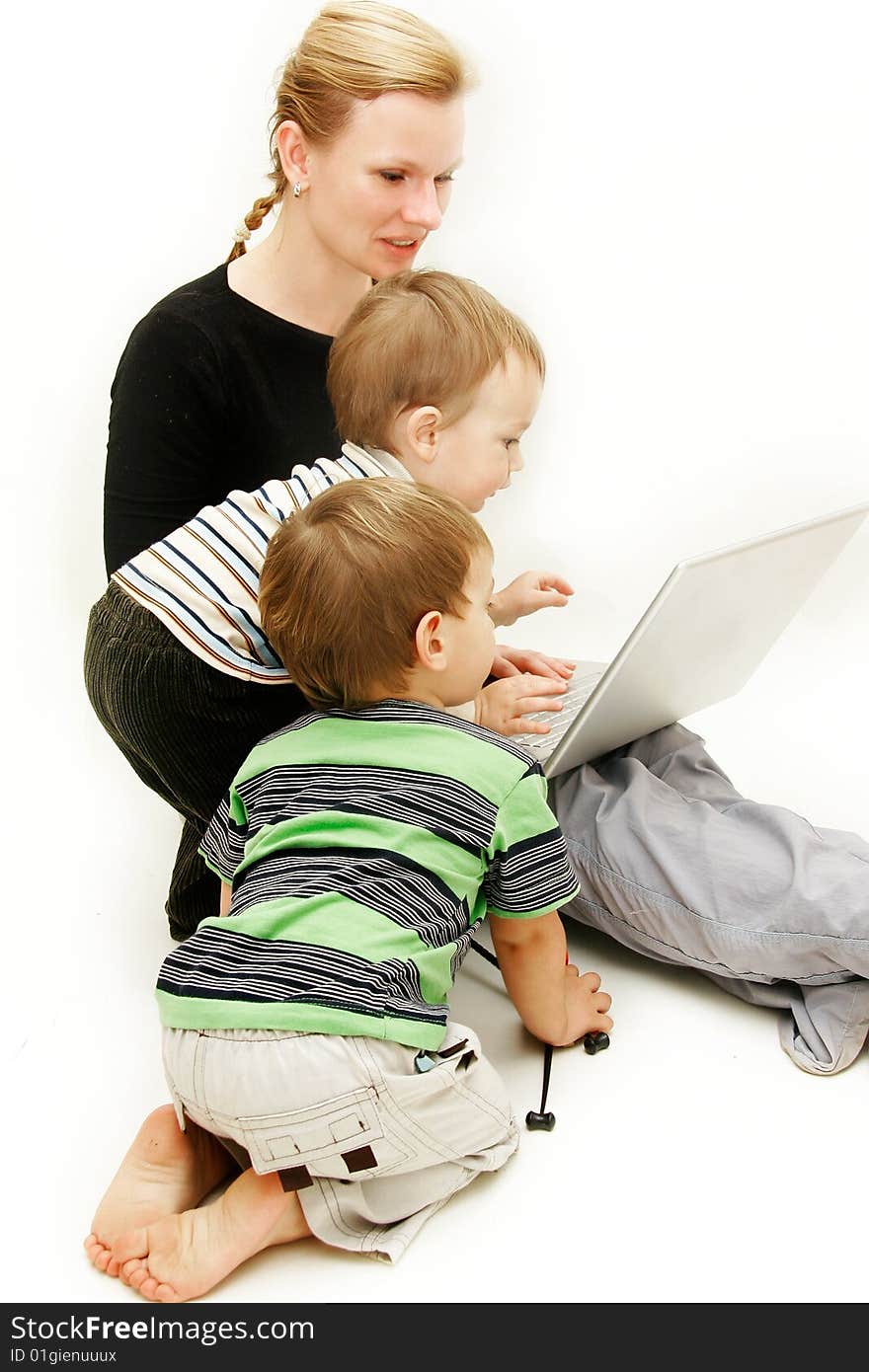 Mother with 2 children and laptop