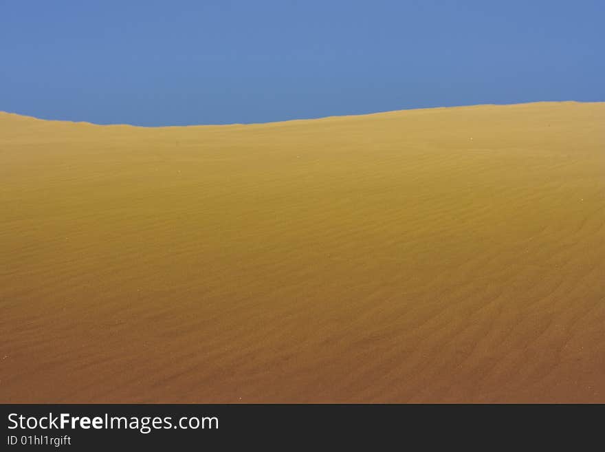 A photo of the warm texture of a desert. A photo of the warm texture of a desert.