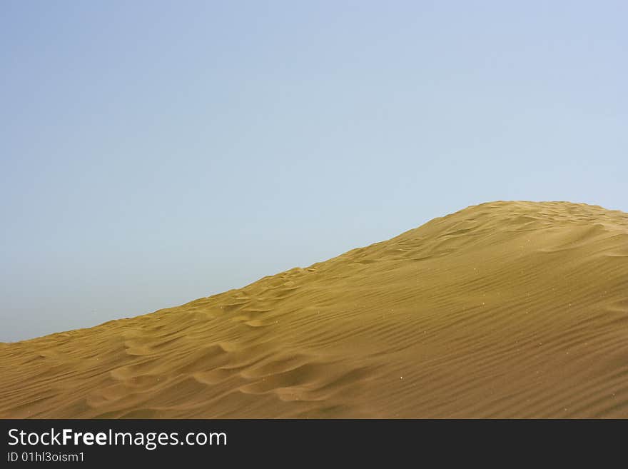 A photo of the warm texture of a desert. A photo of the warm texture of a desert.