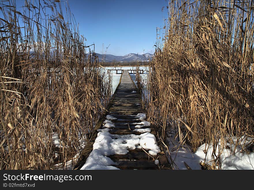 Pier wintertime on the lake, high density range image. Pier wintertime on the lake, high density range image