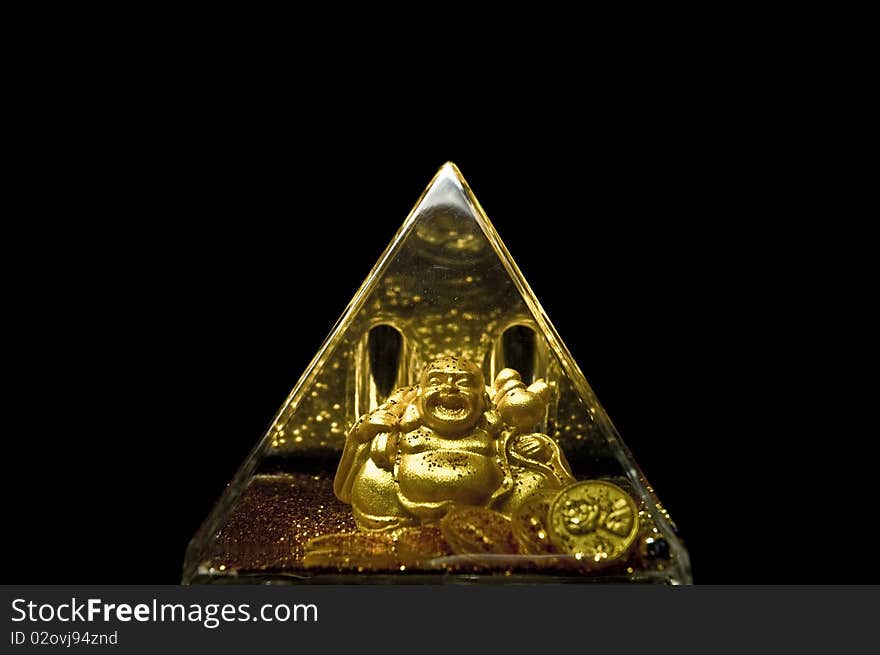 Golden Buddha closed in a pyramid. Golden Buddha closed in a pyramid