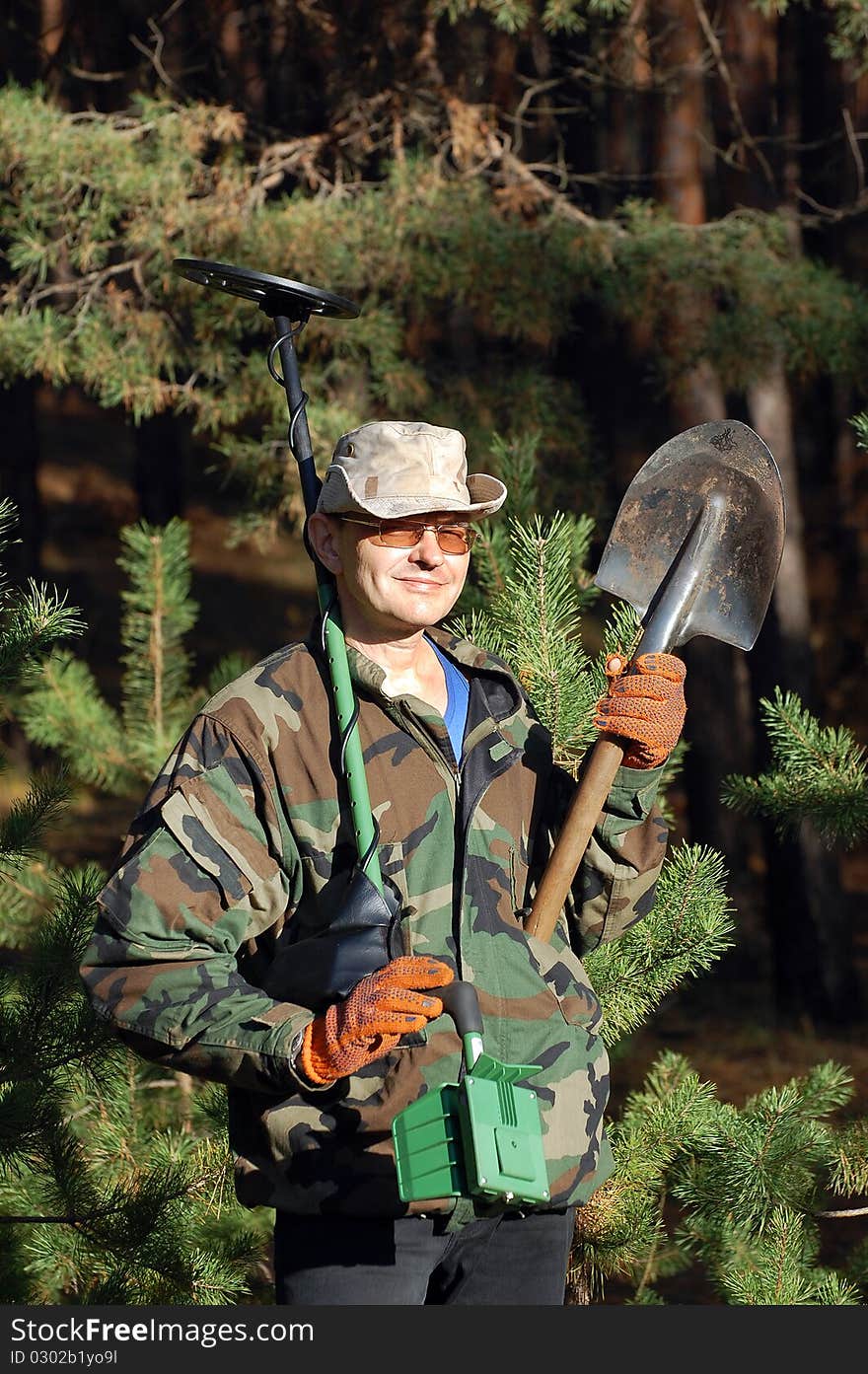 Military archeology. Man with metal detector on the battlefield of WW2.Ukraine