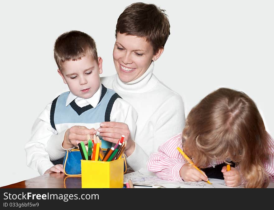 Mother and children together paint an album