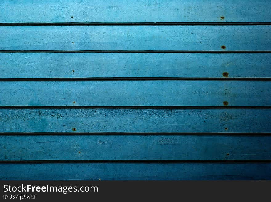 Close up of blue wooden well