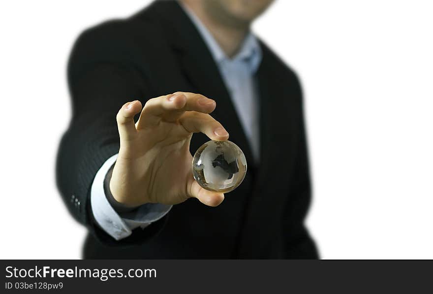 Businessman holding small crystal globe. Businessman holding small crystal globe