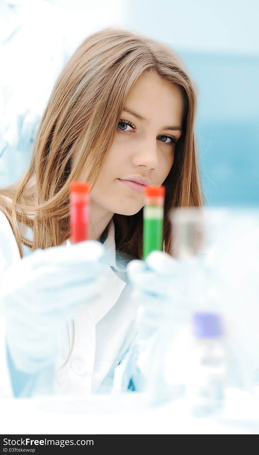 A female scientist working in a Lab with a test tube