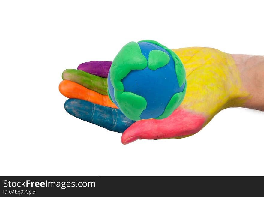 Colorful hand holding the palm made ​​from clay earth globe. Isolated on white background with clipping path. Colorful hand holding the palm made ​​from clay earth globe. Isolated on white background with clipping path