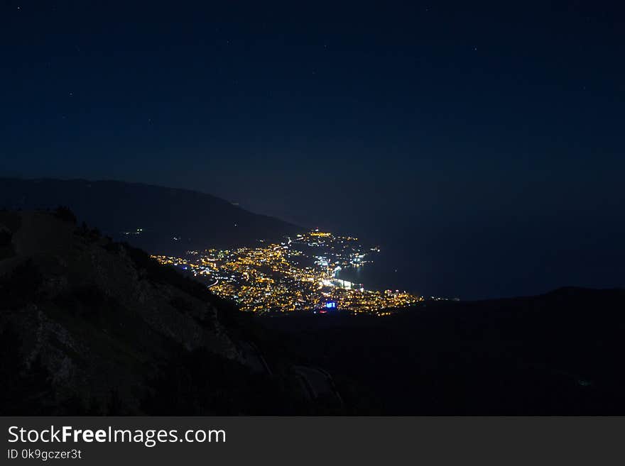 Stunning views of the night city from Mount Ai-Petri peninsula Crimea. Mountain landscape.