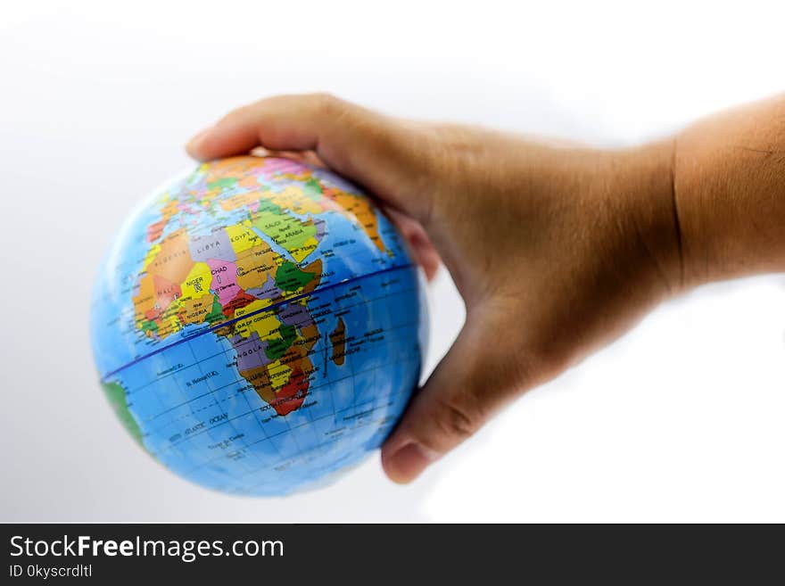 Holding globe world map on hands.