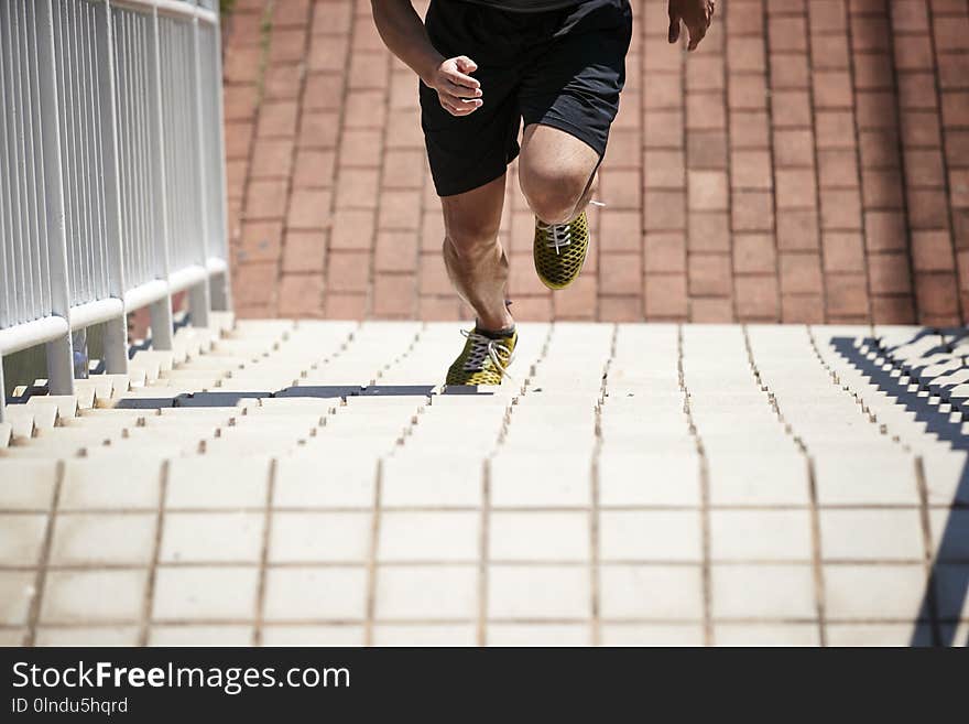 Young asian male athlete training on steps