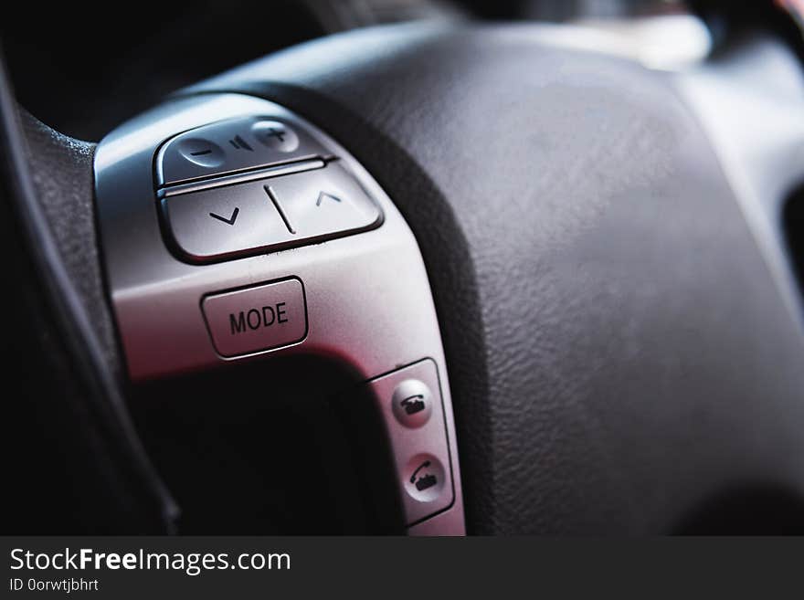 Close up steering wheel with control buttons close-up. Car stereo system control