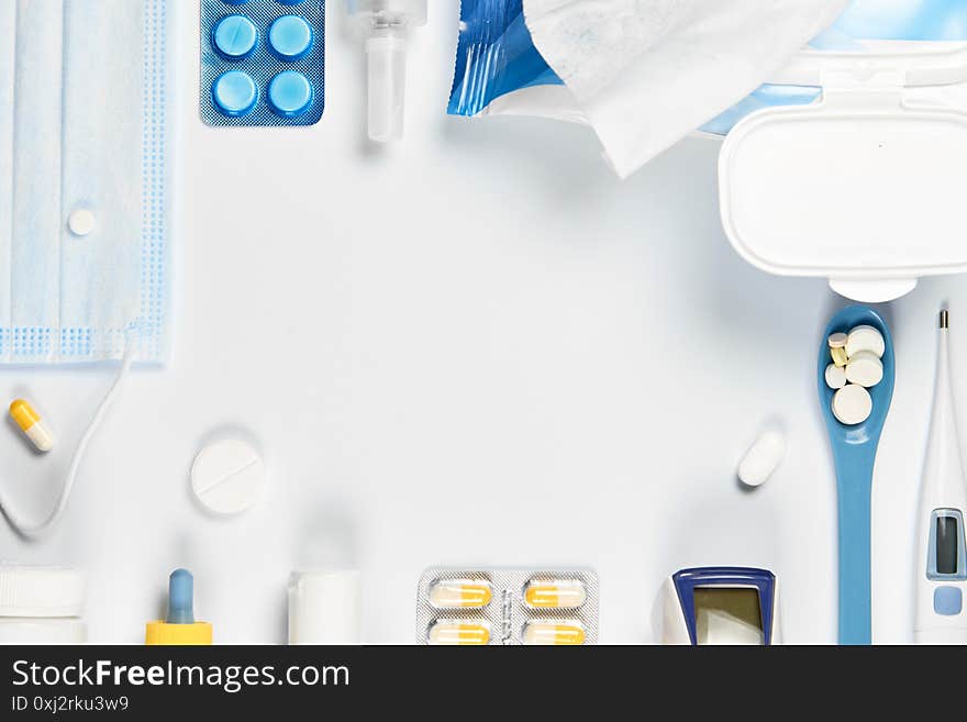 Medicine, healthcare and pharmacy concept - set of pills, tablets - cotonavirus, flu, cold health care. on white background from above copy space. Flatlay. Medicine, healthcare and pharmacy concept - set of pills, tablets - cotonavirus, flu, cold health care. on white background from above copy space. Flatlay