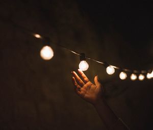 Preview wallpaper garland, light bulbs, hand, touch, light