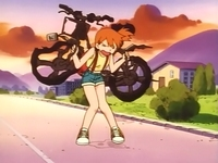 Misty con su bici chamuscada.