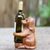 Wood wine bottle holder, 'Puppy Hug' - Handcrafted Suar Wood Dog Wine Holder