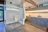 Exposed wooden beams continue into the master bath. 