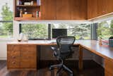 Windows at the desk level are integrated into the cabinets and provide views of the golf course.