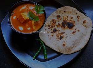 A picture of Paneer Butter Masala & Tandoori Roti.