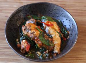 A picture of Stir fried tin of sardines with chilli spinach 🐟 🌶.