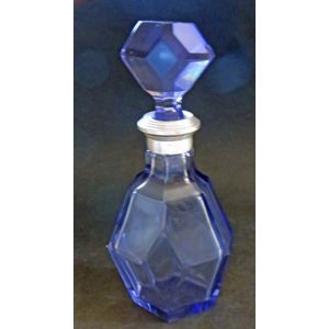 A vintage amethyst decanter with a .800 silver collar. It is amethyst but appears blue in the photo. It does have a small flea...