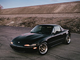 Black NA Mazda Miata Against the Sunset