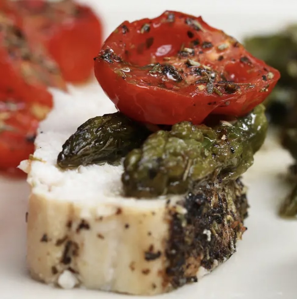 Herb-crusted chicken with tomato and asparagus 