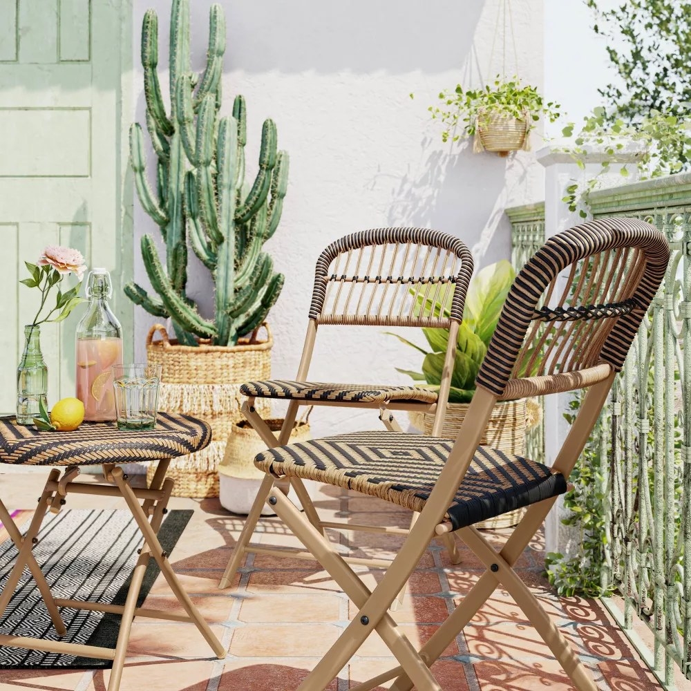 two of the chairs and the matching table on a deck