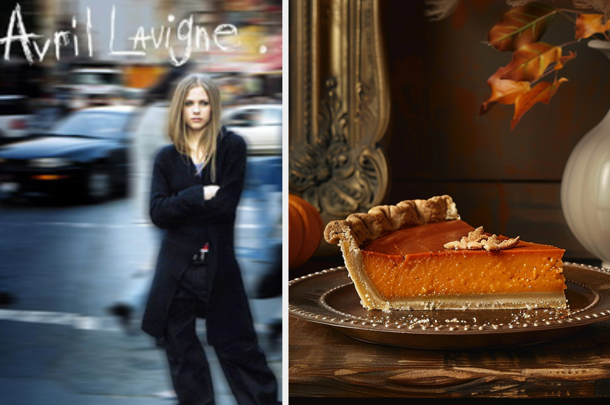 Avril Lavigne stands with arms crossed on a blurred city street next to an autumn-themed table with a slice of pumpkin pie