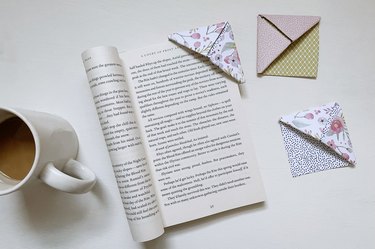 Origami corner bookmark marking page in book