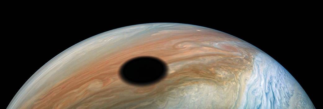 Jupiter's moon Io cast a shadow on the planet.  The width of the shadow is regarding 3600 km.  Photo = NASA/JPL-Caltech/SwRI/MSSS