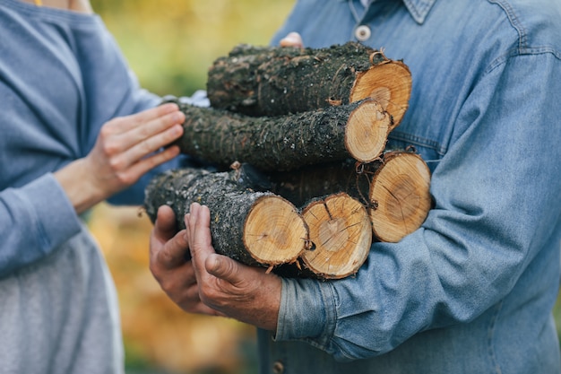 grandfather-with-granddaughter-yard-with-firewood-hands_1157-33014.jpg