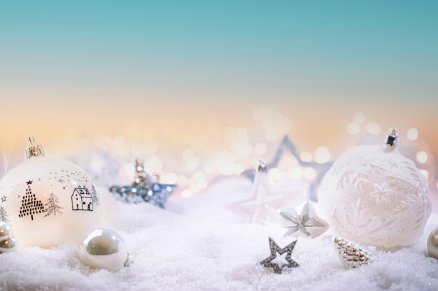 Premium Photo | Christmas white decorations on snow with christmas ...