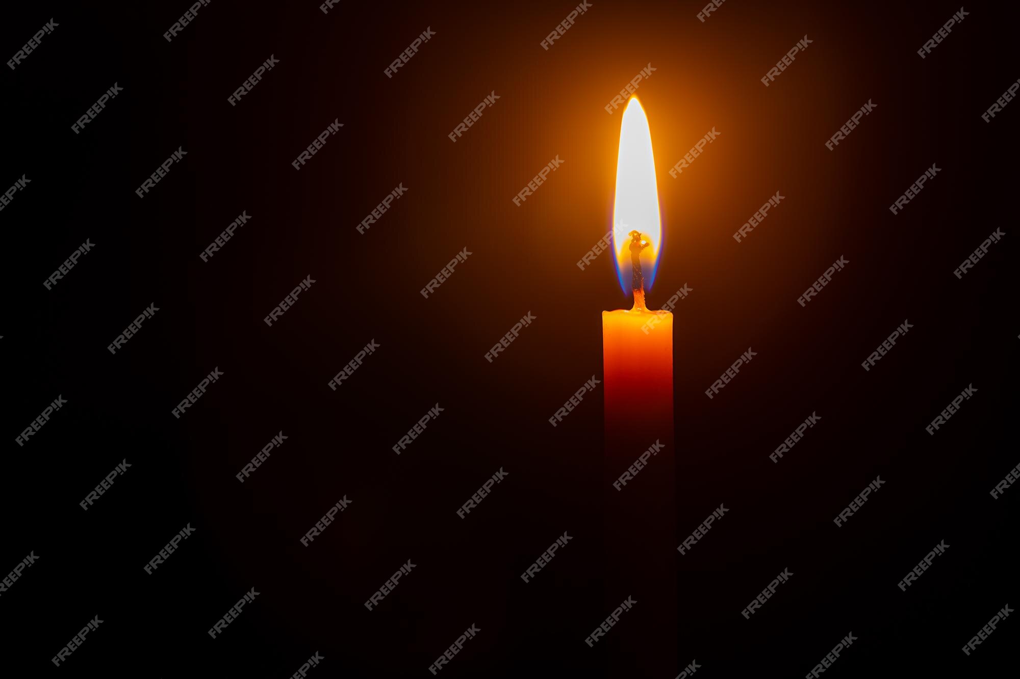 Premium Photo | Close up single candle light and flame on black background