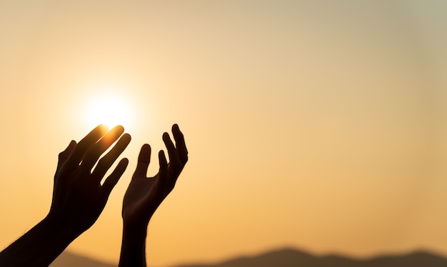 Premium Photo | Closeup woman hands praying for blessing from god during  sunset background. hope and freedom concept.