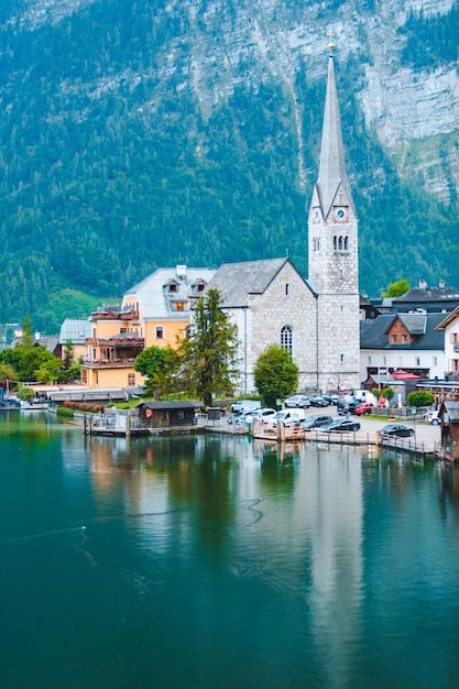 Premium Photo | Evangelical hallstatt church at lake shore alps ...