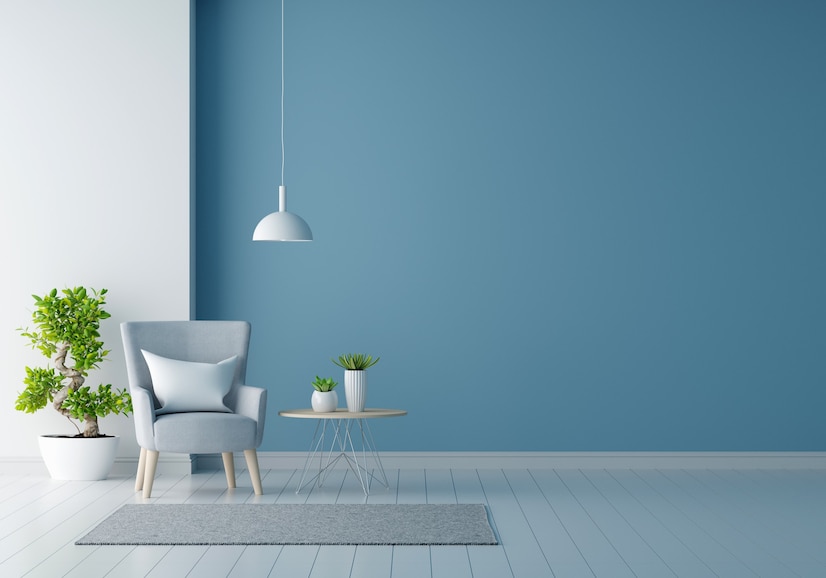 Premium Photo | Gray armchair in blue living room with copy space