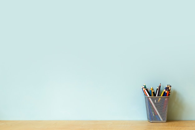 Premium Photo | Home office desk table background. empty wall with wooden  table with stationery, pencils for work or study. copy space . high quality  photo