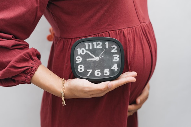 Premium Photo | Muslim pregnant woman holding her belly stomach and ...