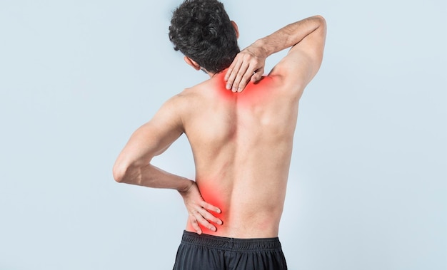 Neck and back pain concept man with neck and back muscle pain\
close up of man with neck and back pain a man with muscle pain on\
isolated background