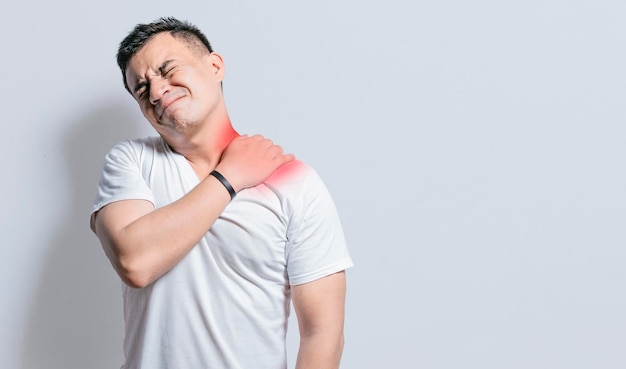 Neck and back pain concept man with neck and back muscle pain\
close up of man with neck and back pain a man with muscle pain on\
isolated background