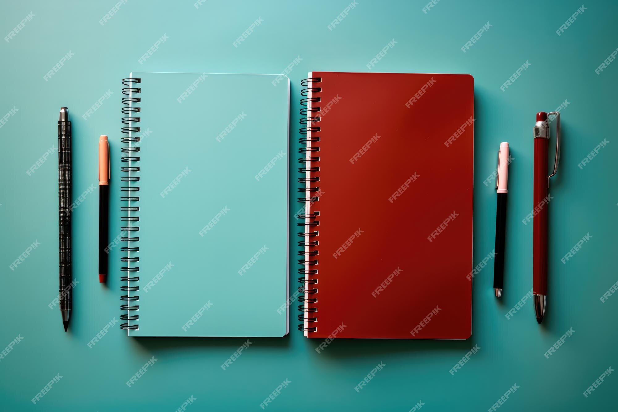 Premium Photo | Notebooks and pens on a blue background Business or ...