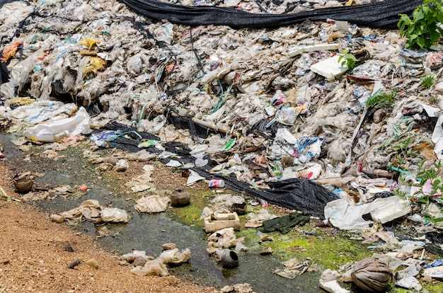 Phetchabun province, thailand-july 28: picture blur of the\
waste and waste water in disposal open dump. dump site at\
phetchabun province on july 28 , 2016